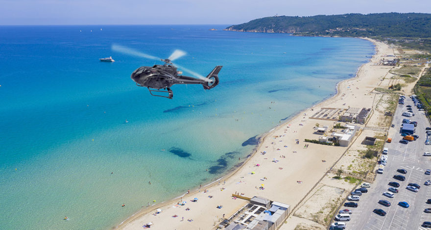 Helicopter flying above Pampelonne in the Gulf of Saint-Tropez